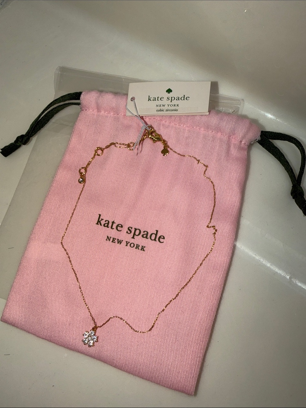 kate spade Adjustable Gold Snowflake Pendant Necklace with Pink Kate Spade Pouch